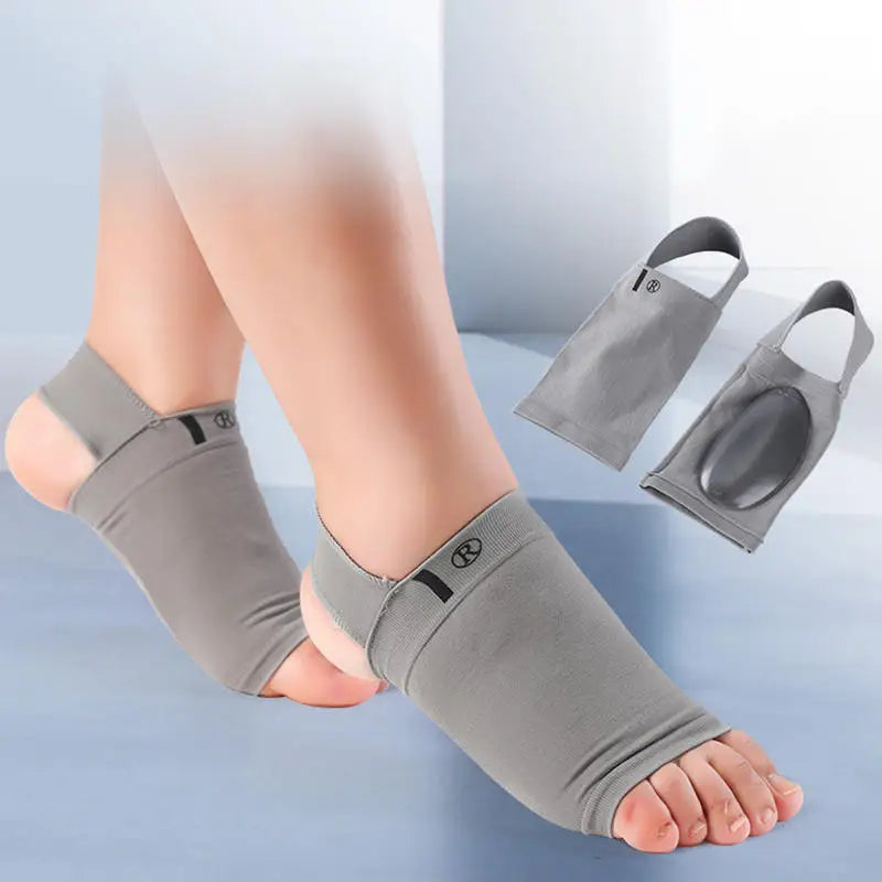 Gray ankle support brace worn by a person on a light blue background