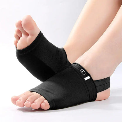 Black foot wraps on a person's feet against a white background