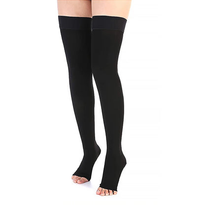 Black knee-high socks worn by a person on a white background