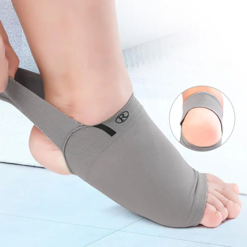 Gray ankle support brace being worn on a foot with a close-up inset showing the sole.