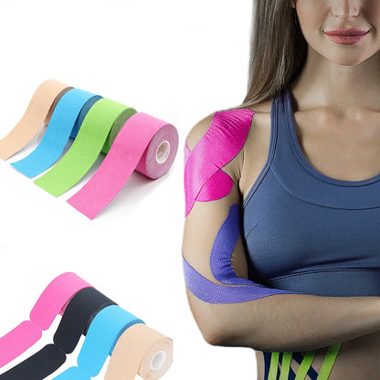 Woman wearing colorful tape on her arm with rolls of tape on a white background