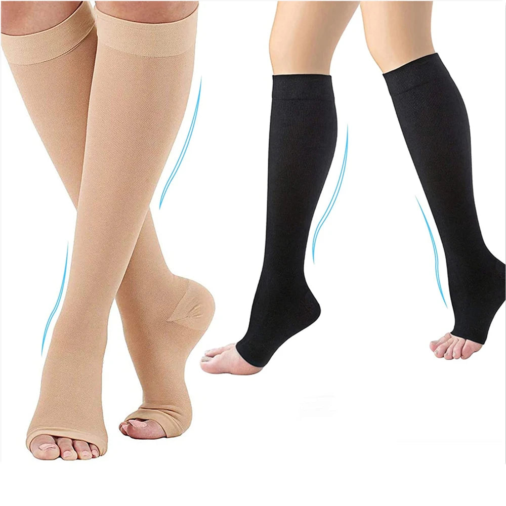 Beige and black compression socks on a white background