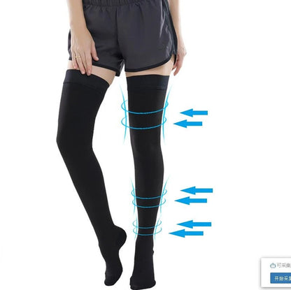 Person wearing black knee-high socks with blue arrows indicating compression points on a white background