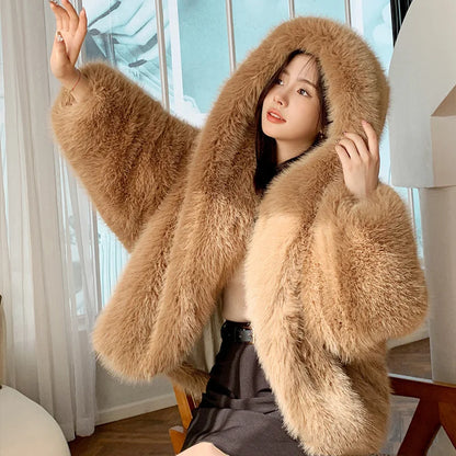 Person wearing a fluffy beige coat indoors