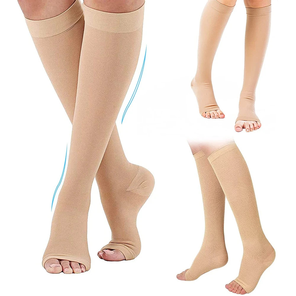 Beige compression stockings worn by a person on a white background