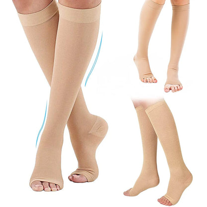 Beige compression stockings worn by a person on a white background